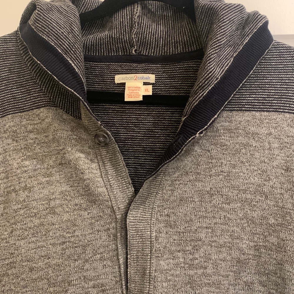 100% cotton cardigan with some marled color blocking colors black and taupe